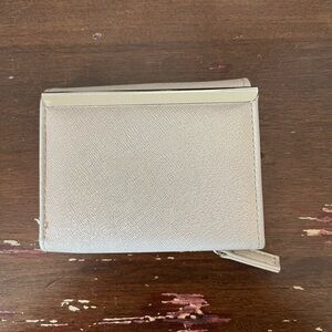 Elegant Cream Wallet with Metal Accent